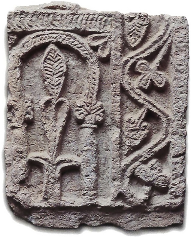 Limestone plaque with floral carvings